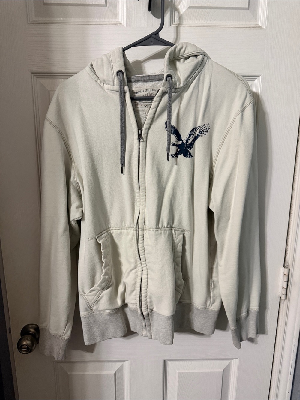 American Eagle Outfitters Light Gray Zip-Up Hoodie with Navy Eagle Logo